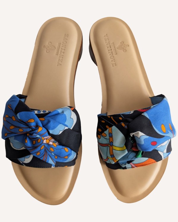 Flat silk and leather sandal Wear your summer sandal like a jewel.