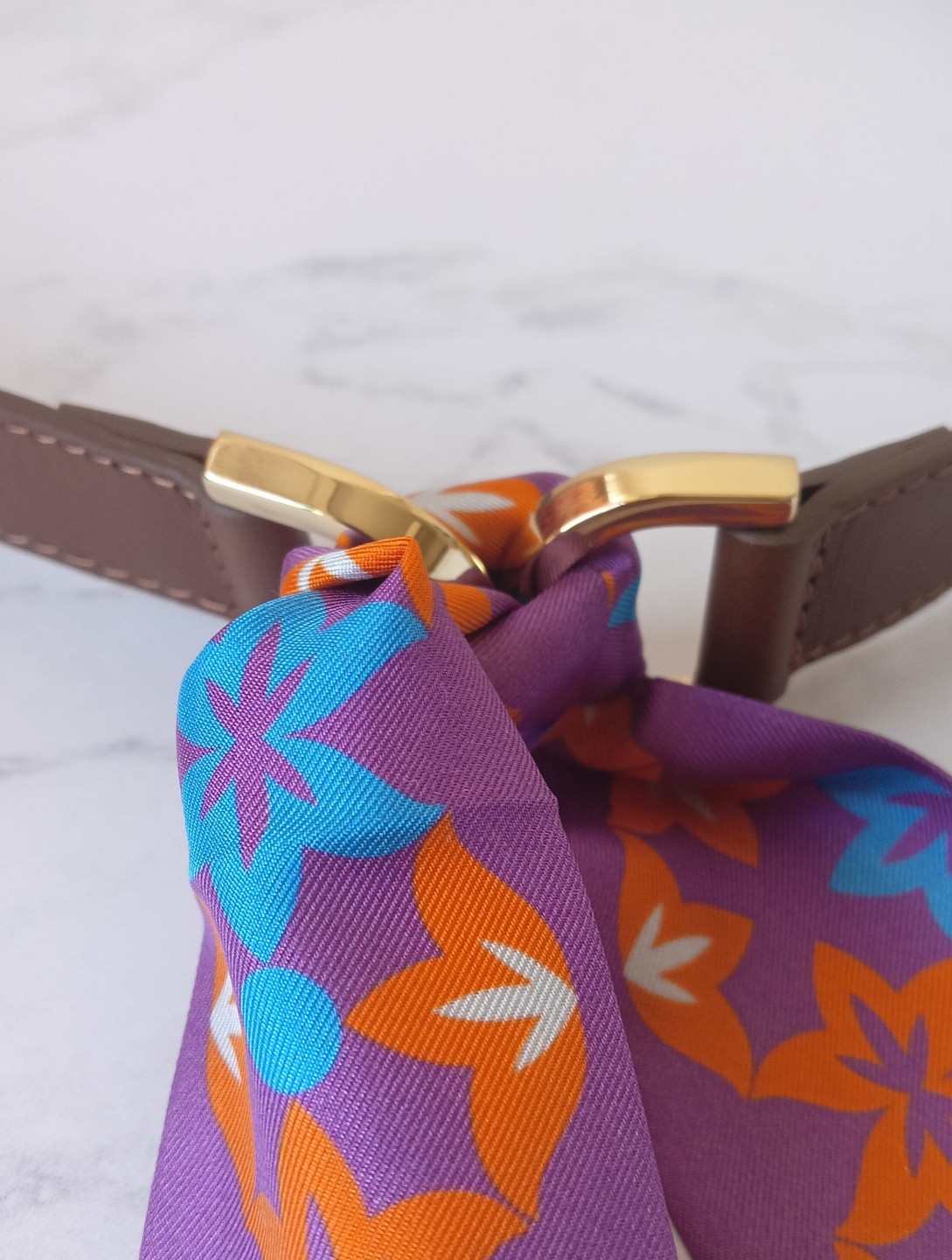 Buy the leather belt that closes with a scarf!